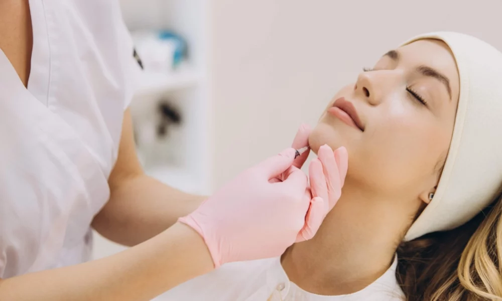 Woman receiving a Masseter Botox injection in Sparta, NJ from a medical professional.