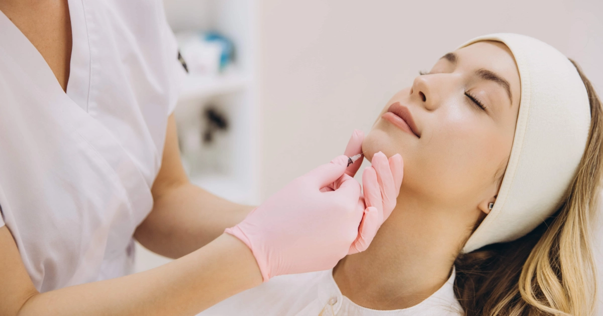 Woman receiving a Masseter Botox injection in Sparta, NJ from a medical professional.
